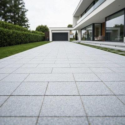 Elegant granite driveway leading to a modern house, showcasing increased property value, no text, no words, no typography, clean image